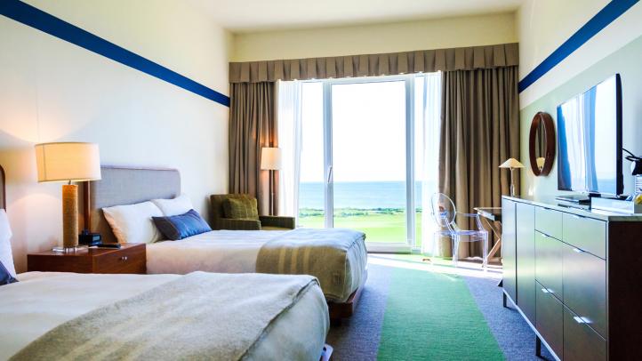 Two beds in a hotel room. 